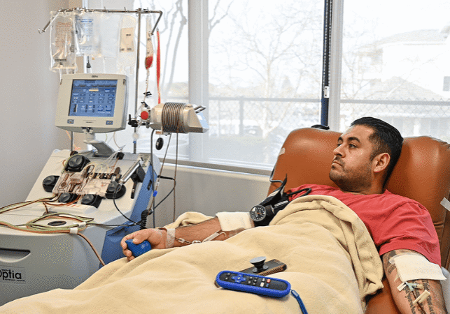 donor hooked up to apheresis machine